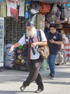 Vermin Supreme doing a funny walk on Venice Boardwalk