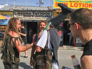 Vermin Supreme talks to some well tanned free people on Muscle Beach